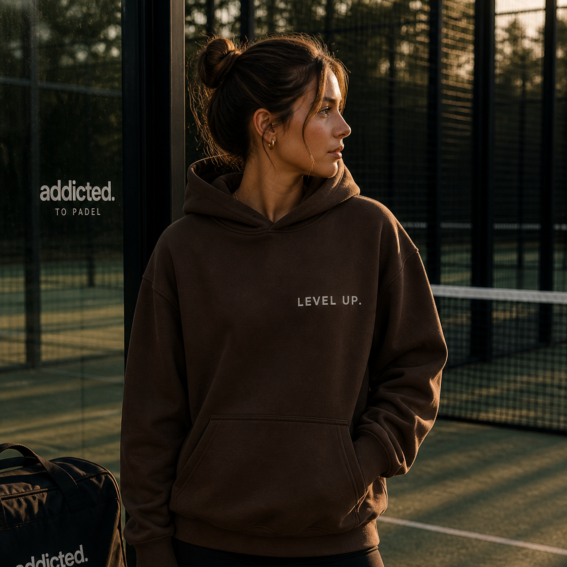 lady on padel court in level up addicted to padel hoodie