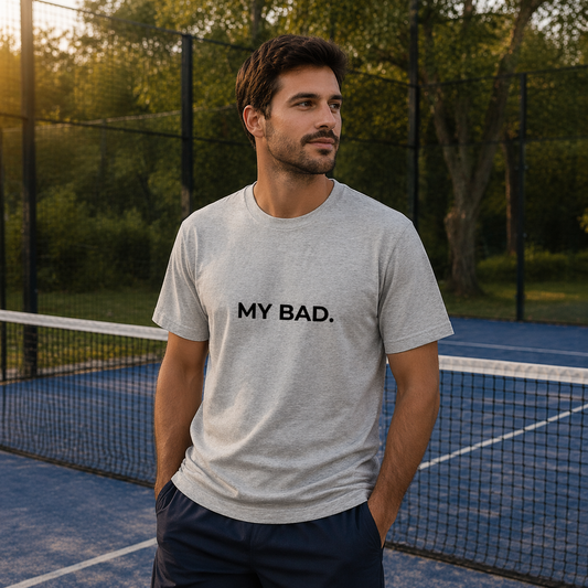 man playing padel in a slogan tshirt from addicted to padel