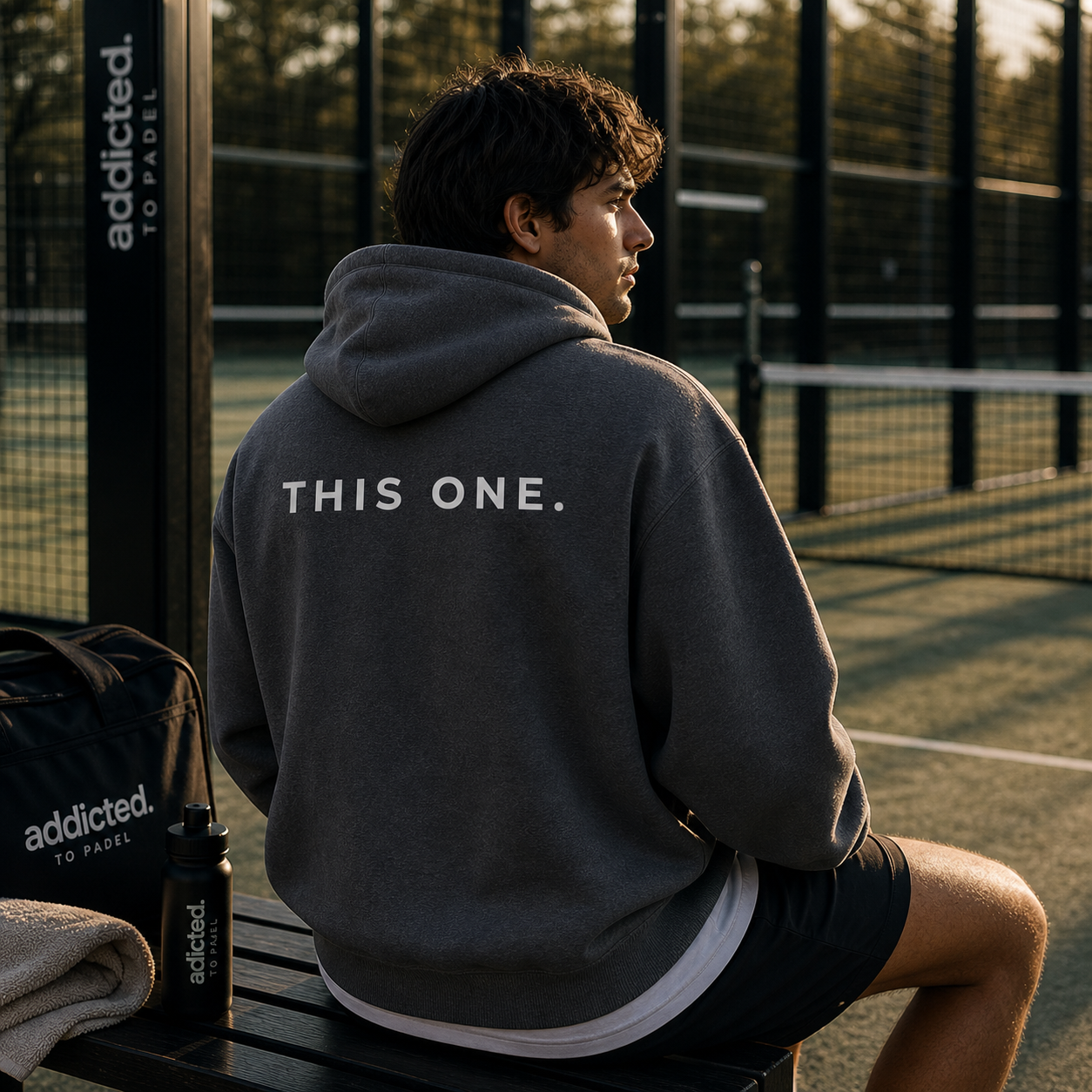 guy at a padel court wearing this one padel hoodie